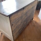 Patinated crossbow chest of drawers.