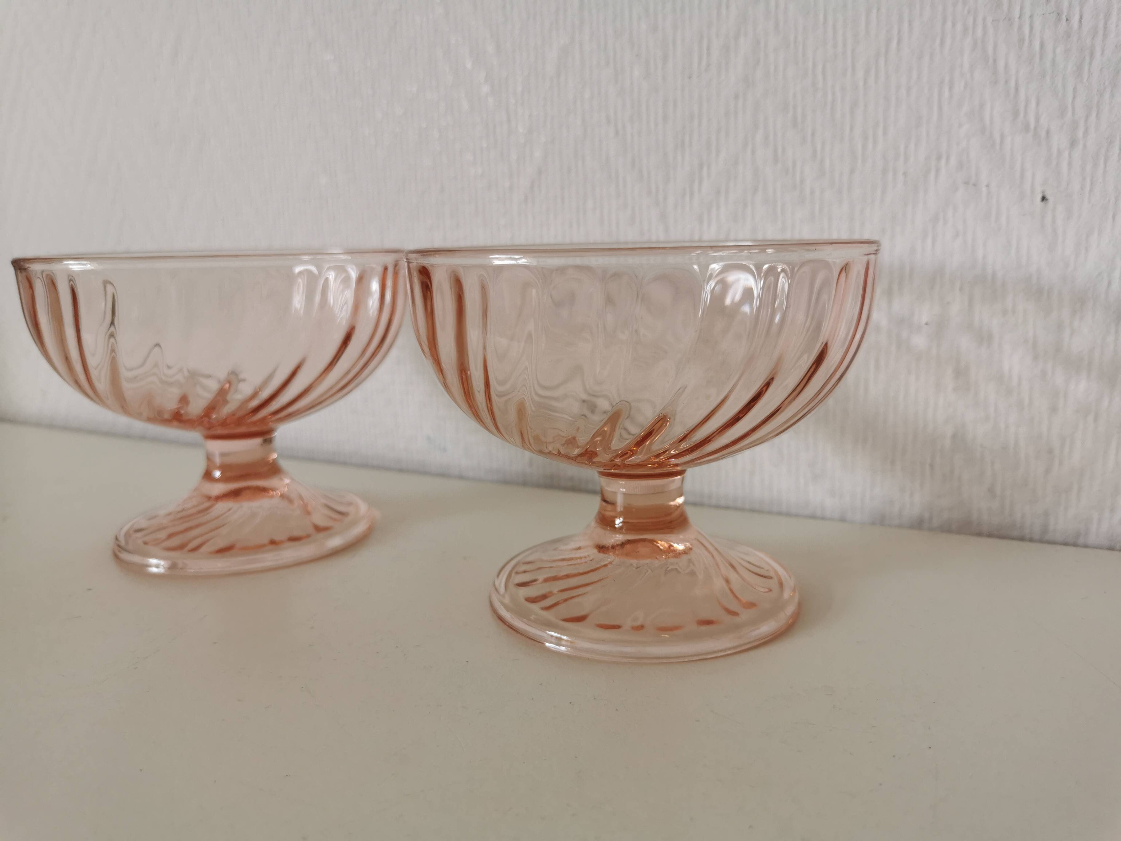 Pair of pink rosaline swirl glass fruit bowls