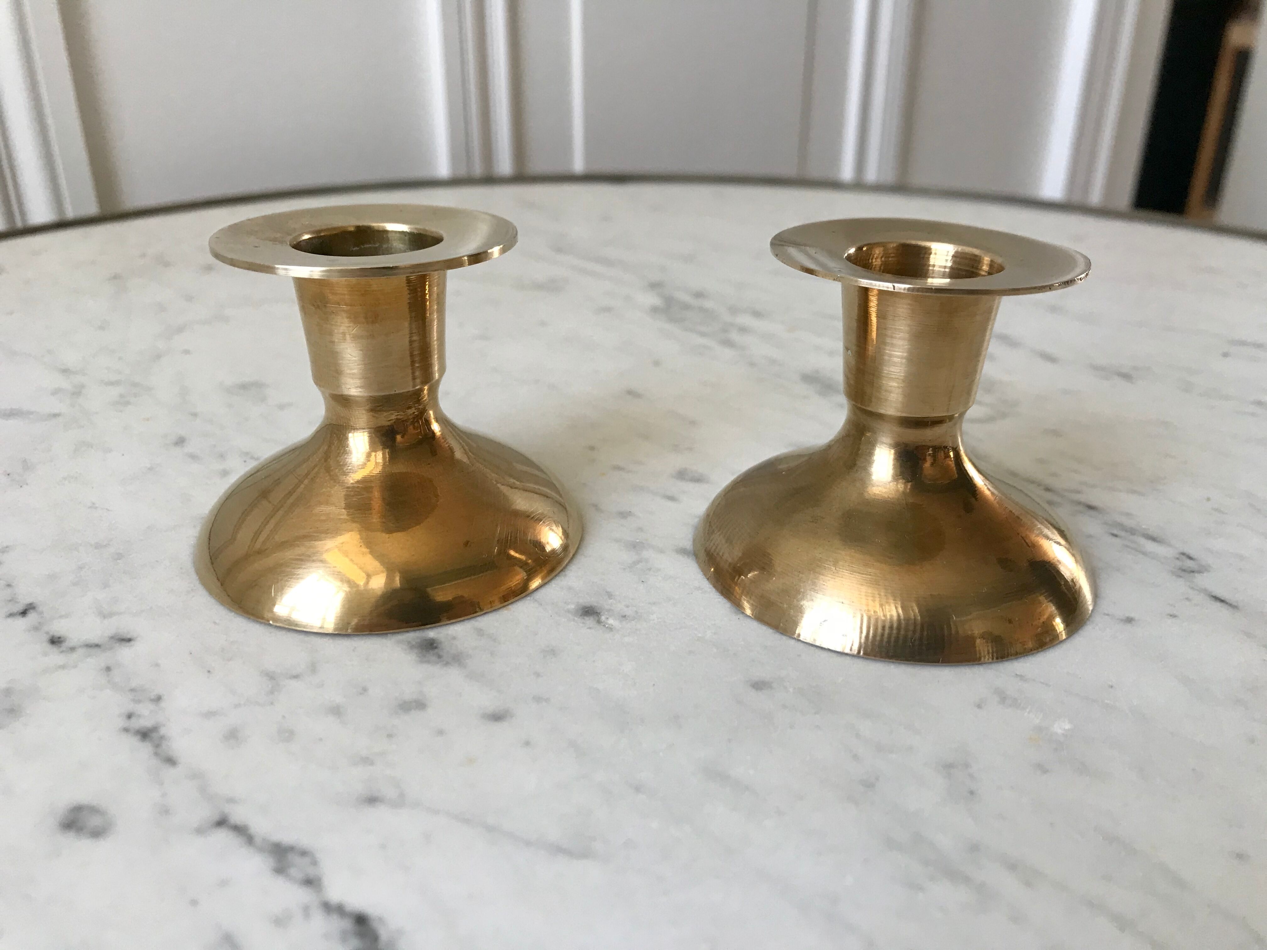 Duo of brass candle holders 20s