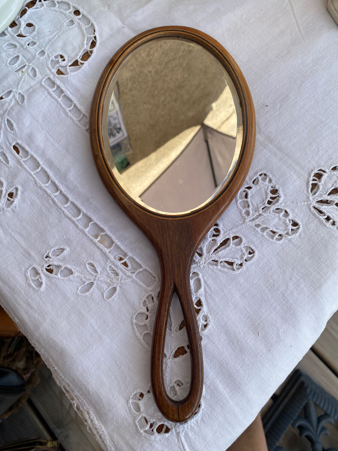 Hand-facing wooden mirror