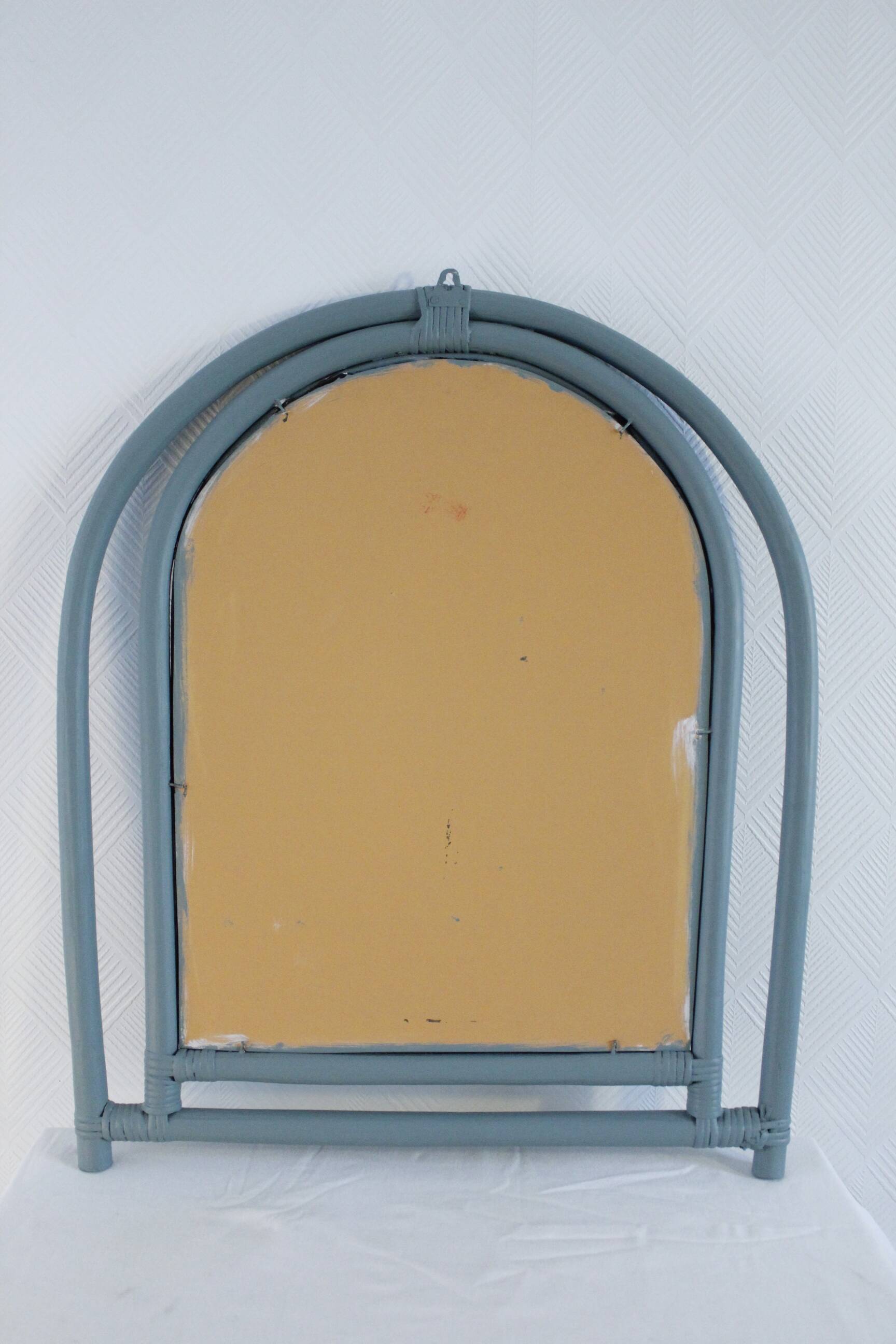 Sage green painted rattan mirror