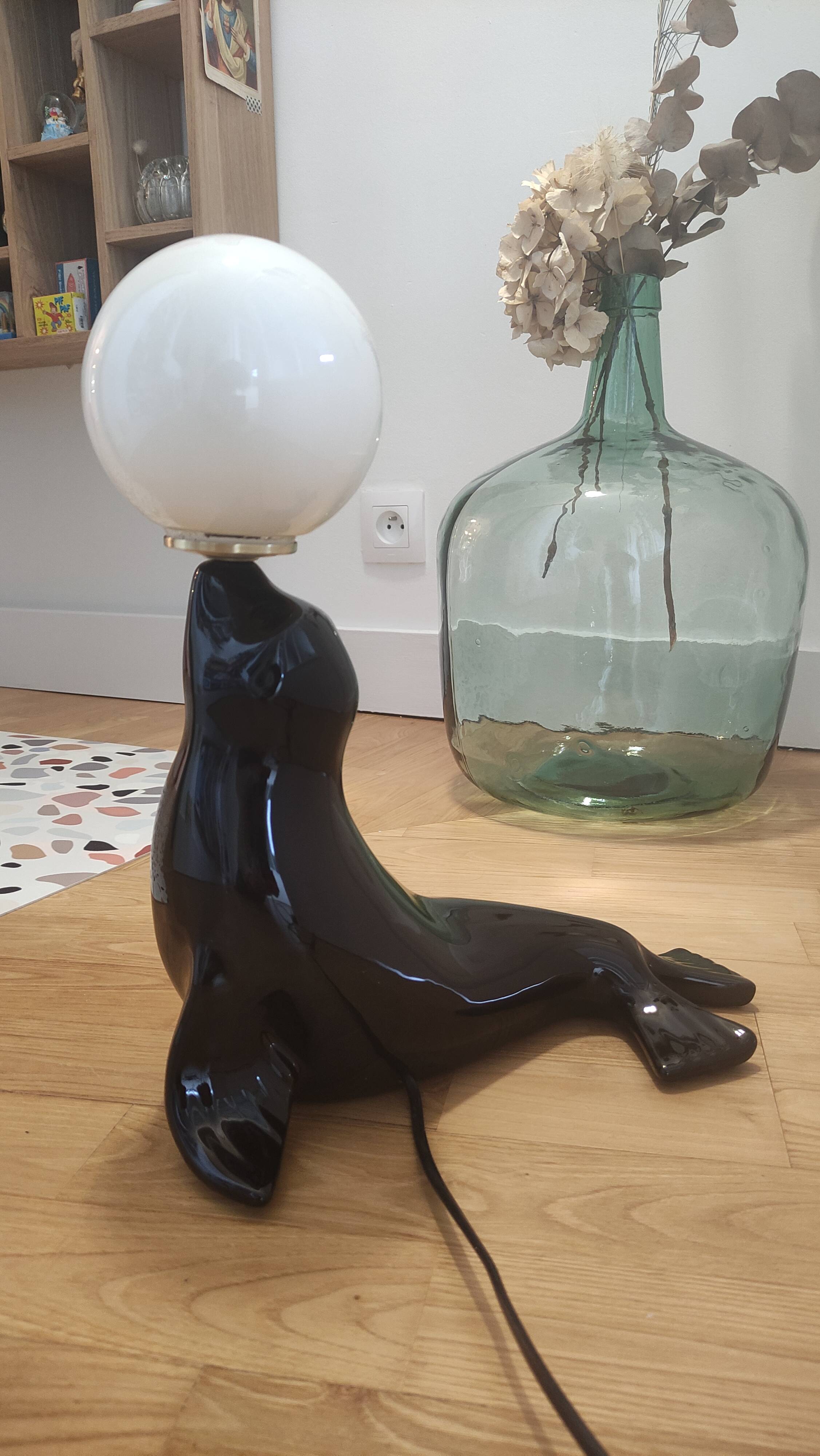 Vintage black sea lion lamp
