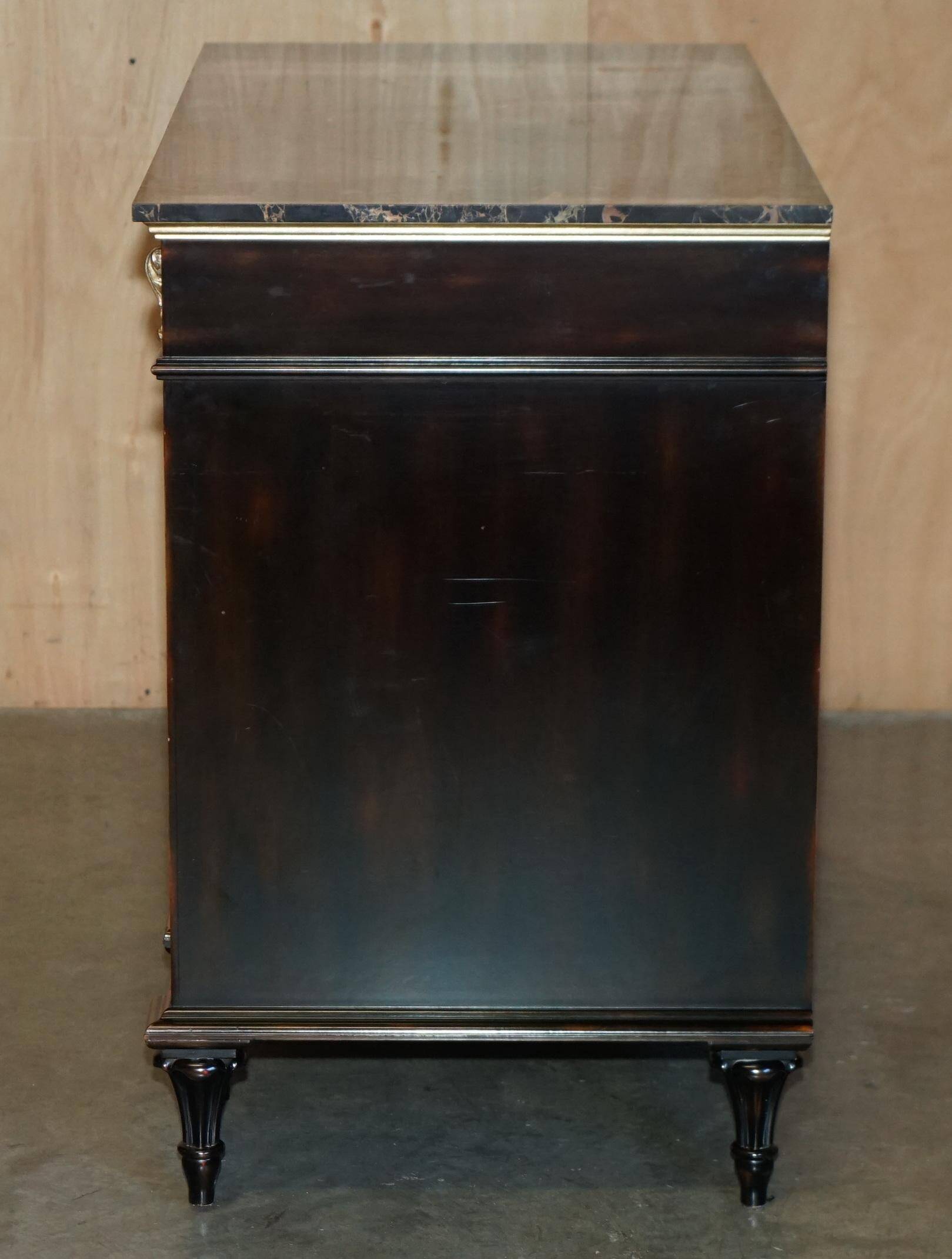 Contemporary Chinese buffet with a marble top and space for a mini-fridge.