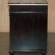 Contemporary Chinese buffet with a marble top and space for a mini-fridge.
