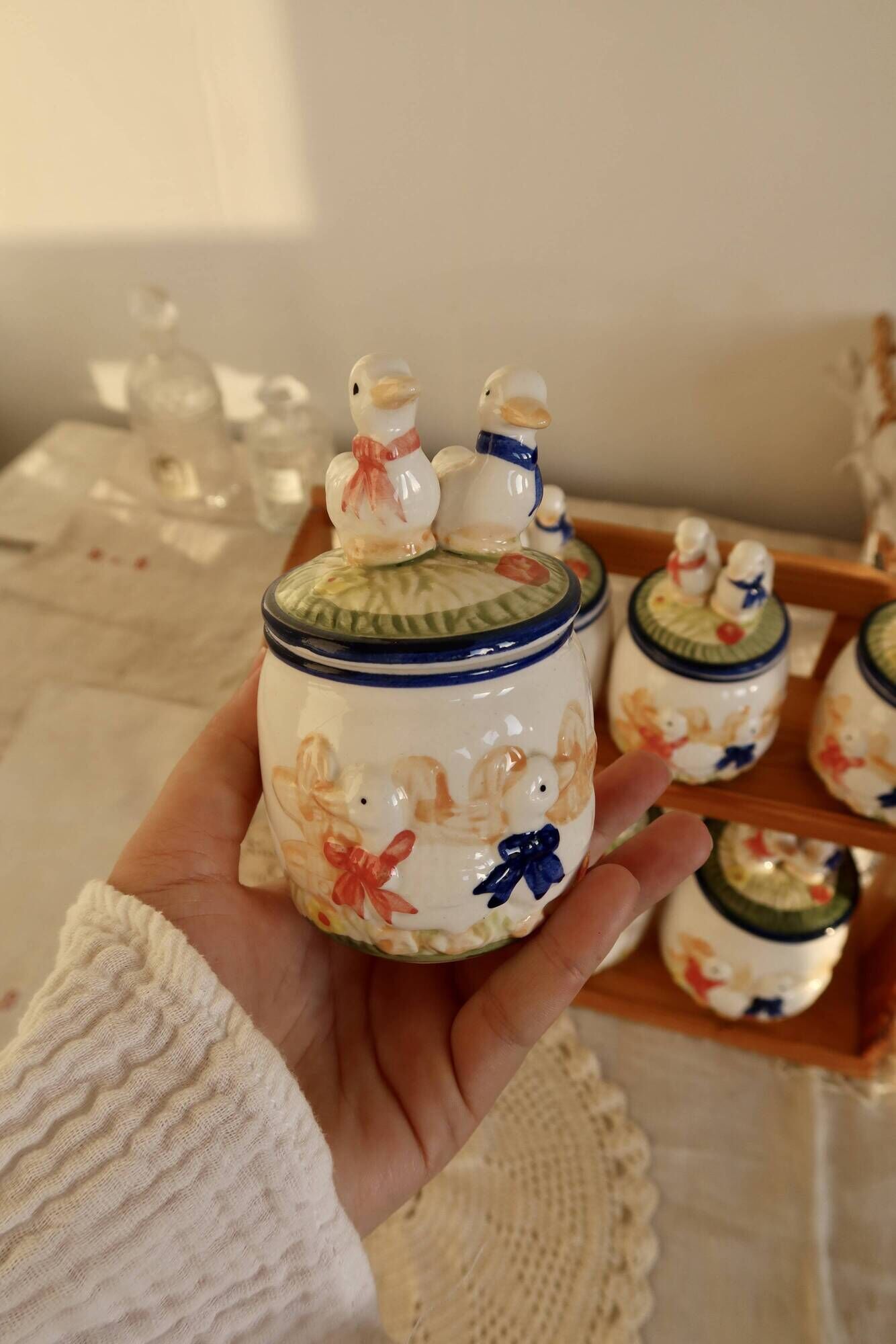 Vintage wooden wall condiment shelf and porcelain pots with geese slip pattern