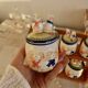 Vintage wooden wall condiment shelf and porcelain pots with geese slip pattern