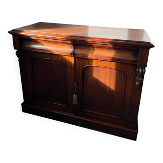 Chest of drawers, low cabinet in English style made of mahogany.