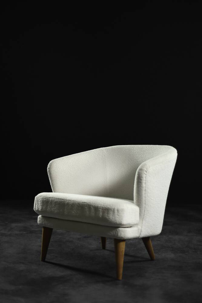 Low oak armchair with modern mid-century Scandinavian fabric and rounded backrest, 1960s.