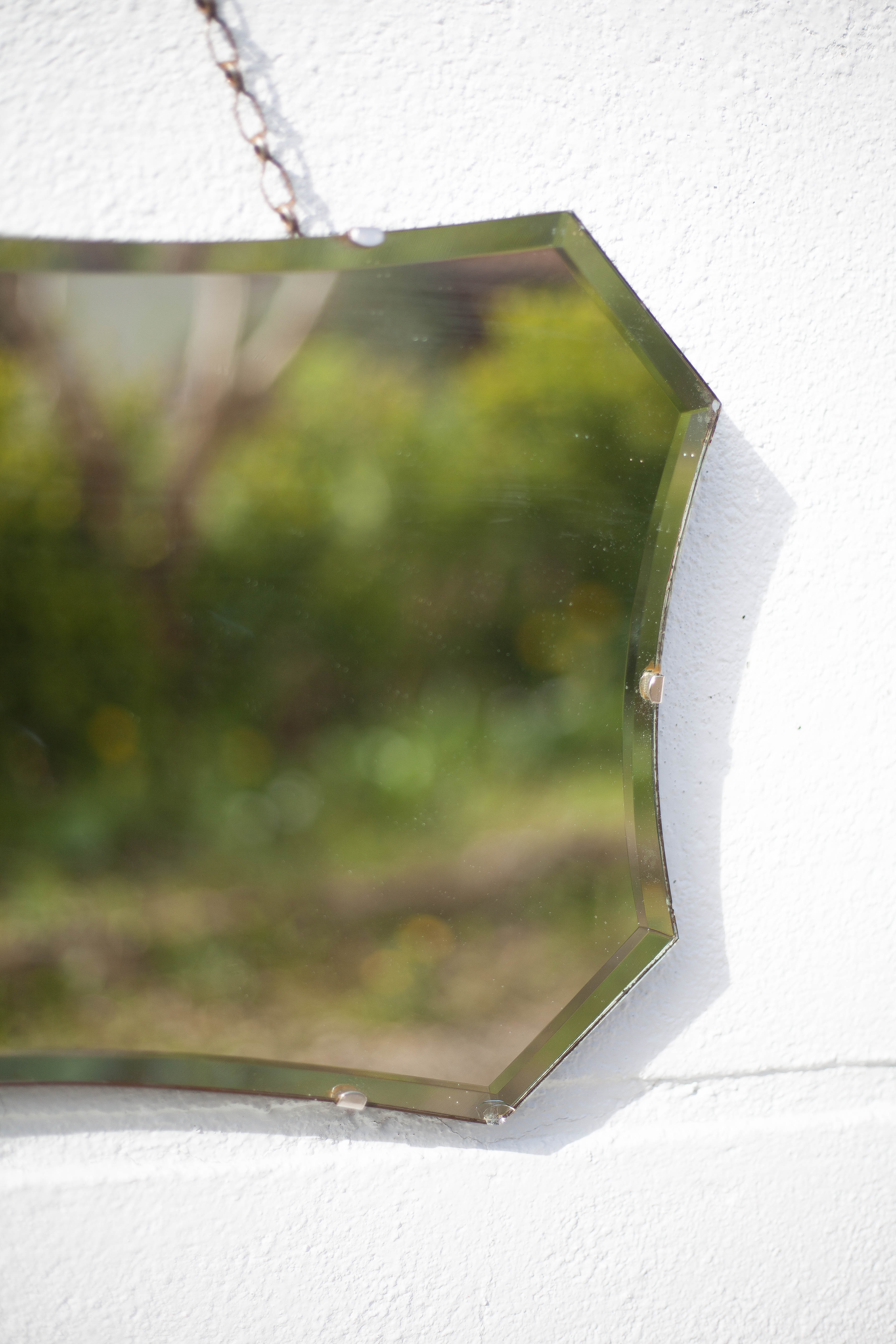 Vintage wall mirror with beveled chain