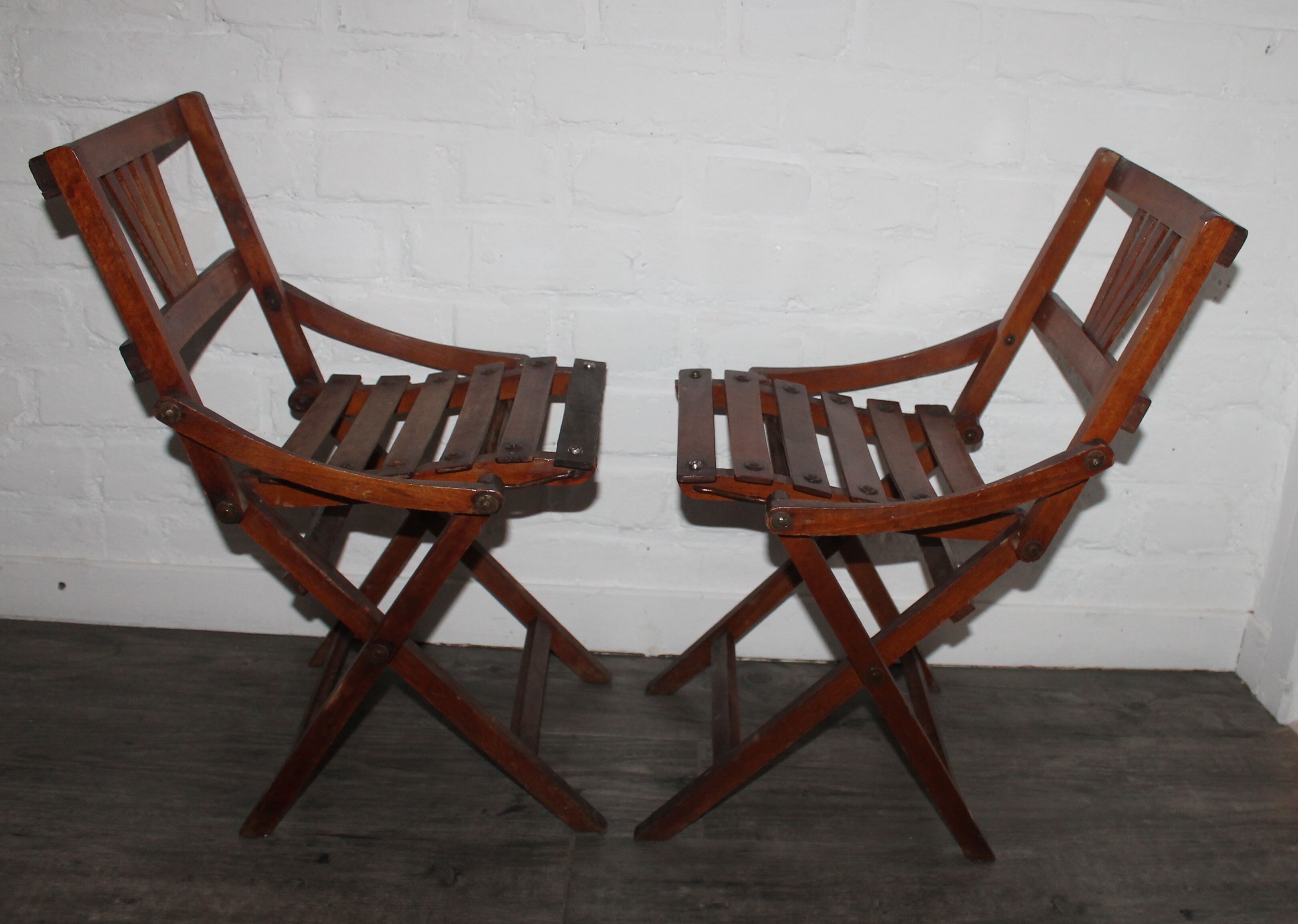 2 wooden folding chairs