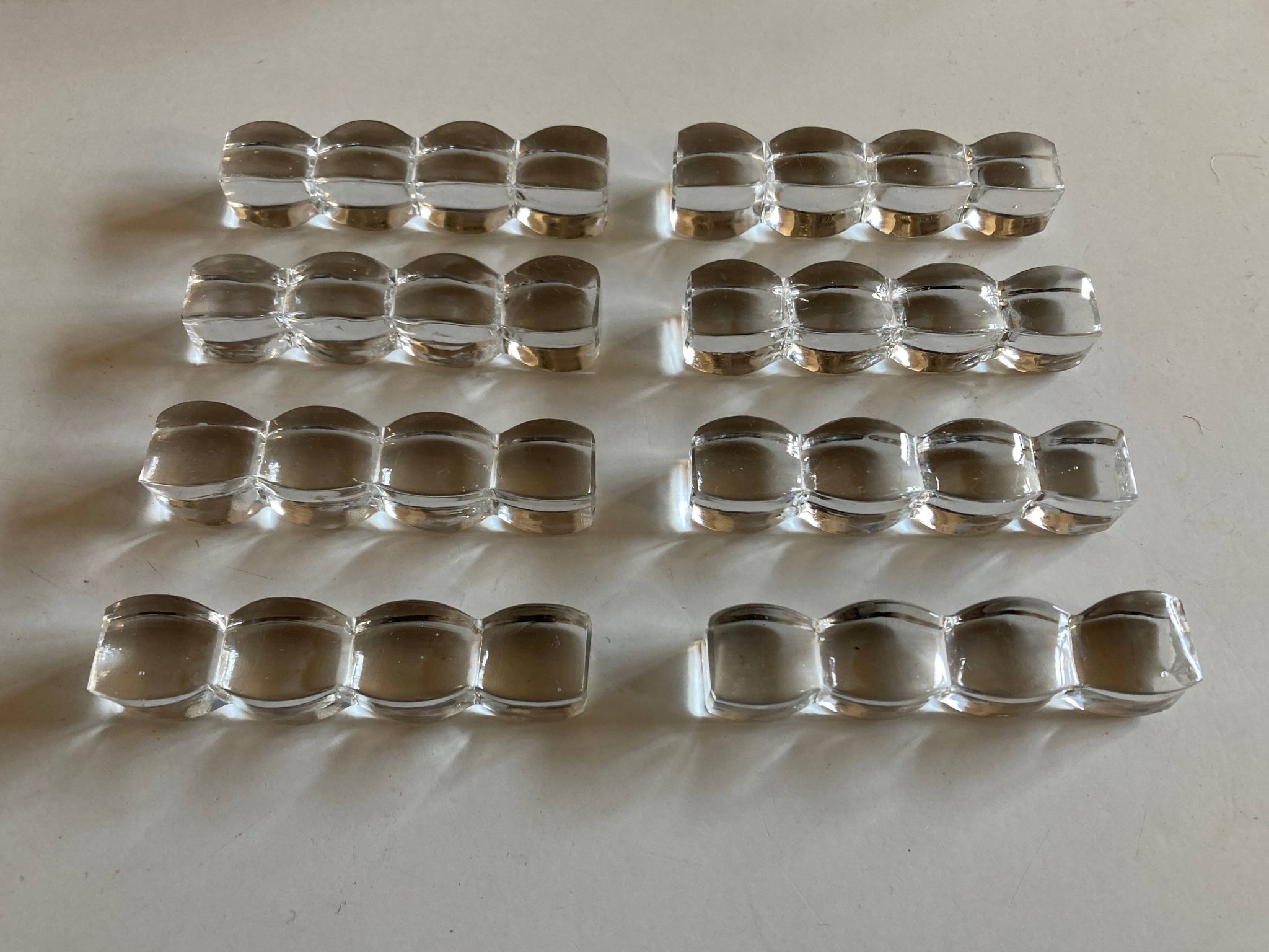 Set of 8 modernist crystal knife rests from the 1940s.