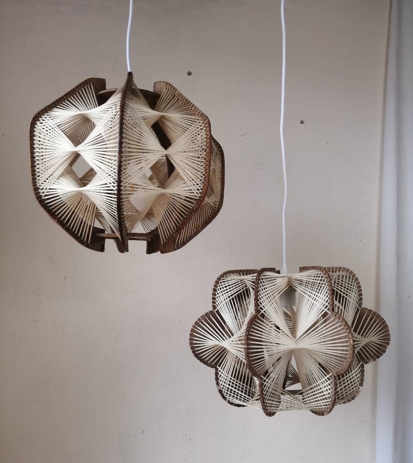 Pair of vintage wooden and rattan straw pendant lights.