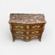 Louis XV period commode with violet wood veneer.