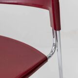 Vintage dining chair from the 1980s by Paolo Favaretto for Assisa, stackable, design Italy 1986 - chrome and red plastic - a classic of design.