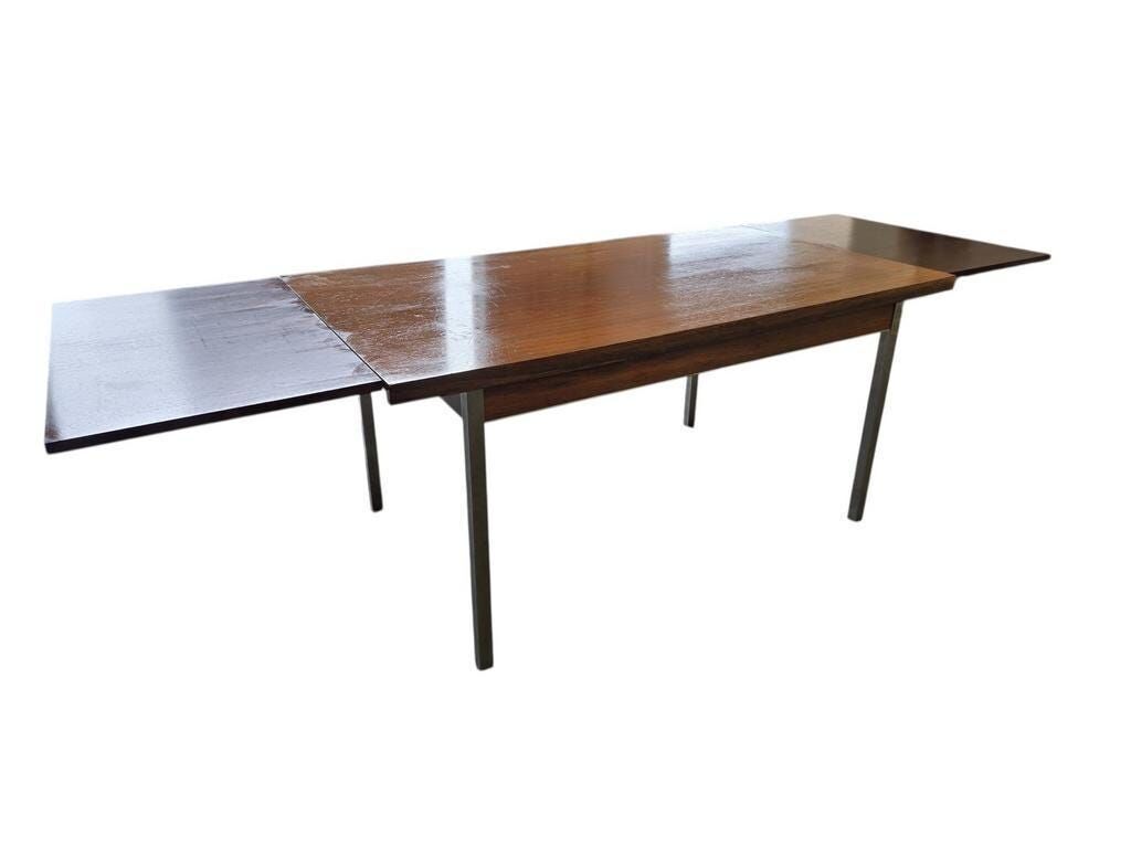 Vintage wooden dining table with chrome frame.