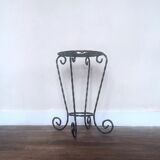 Black wrought iron support for plants