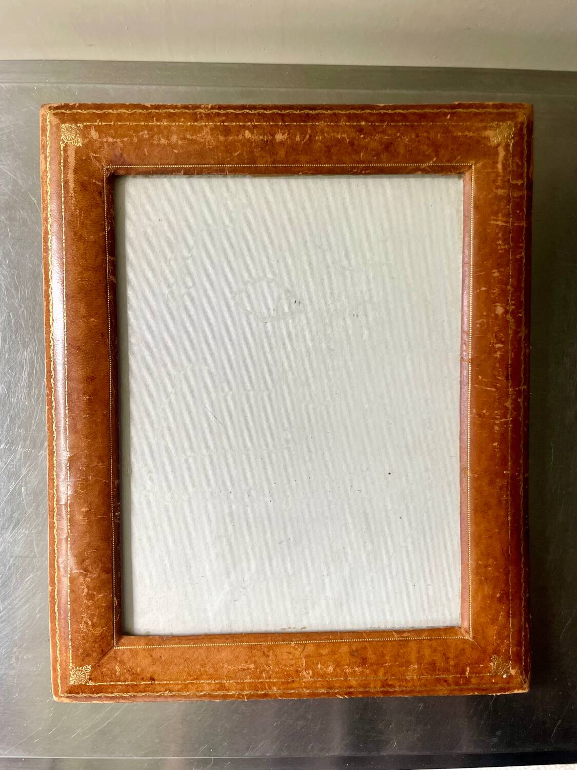 Antique  leather  with gilding frame measurements 31 cm x 25 cm
