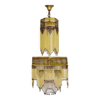 Art Nouveau style bronze chandelier with yellow and mauve pendants, 11 lights. 1960s