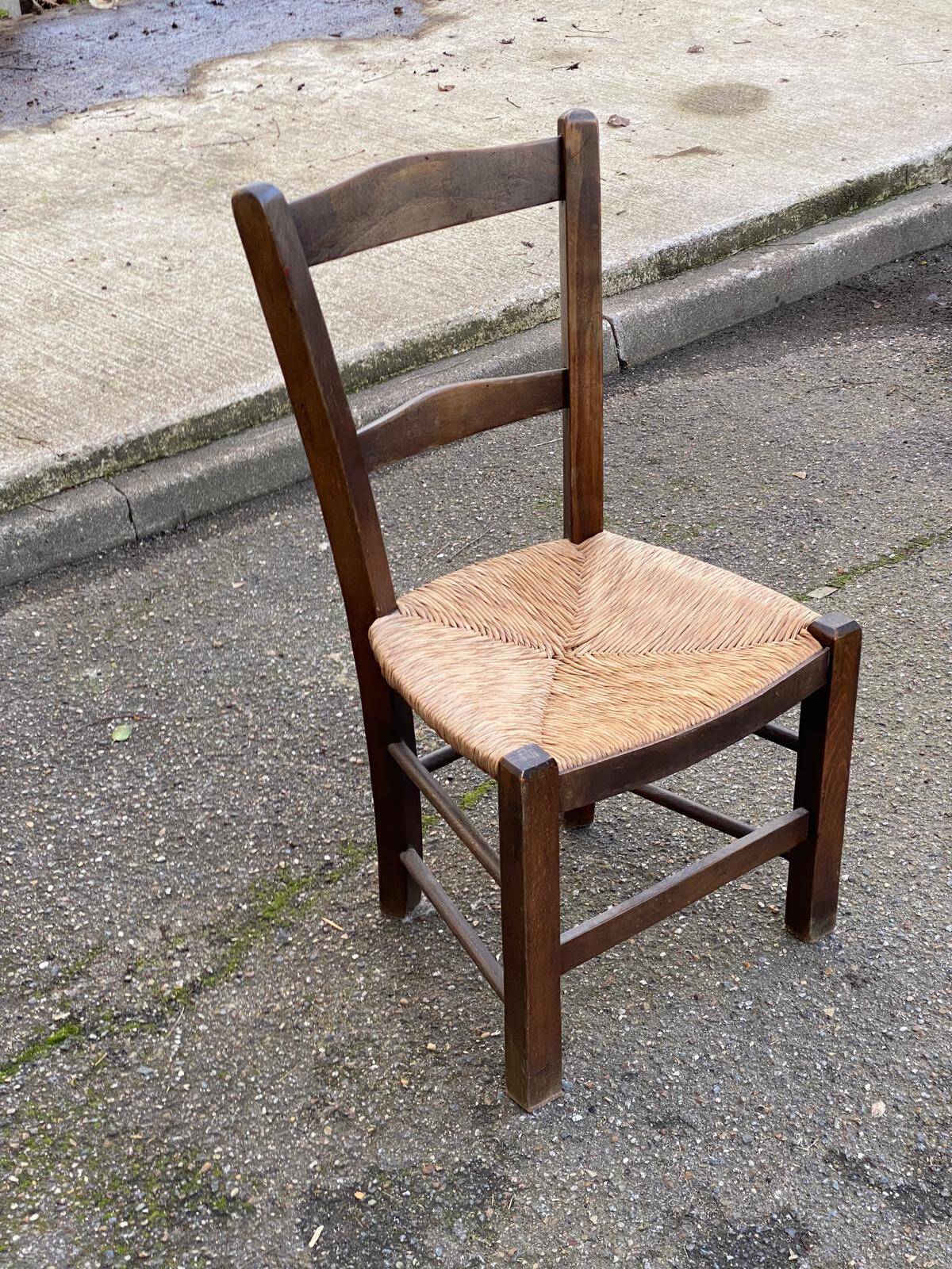 Solid wood chair in dark oak with rush seating, Louis Philippe style.
