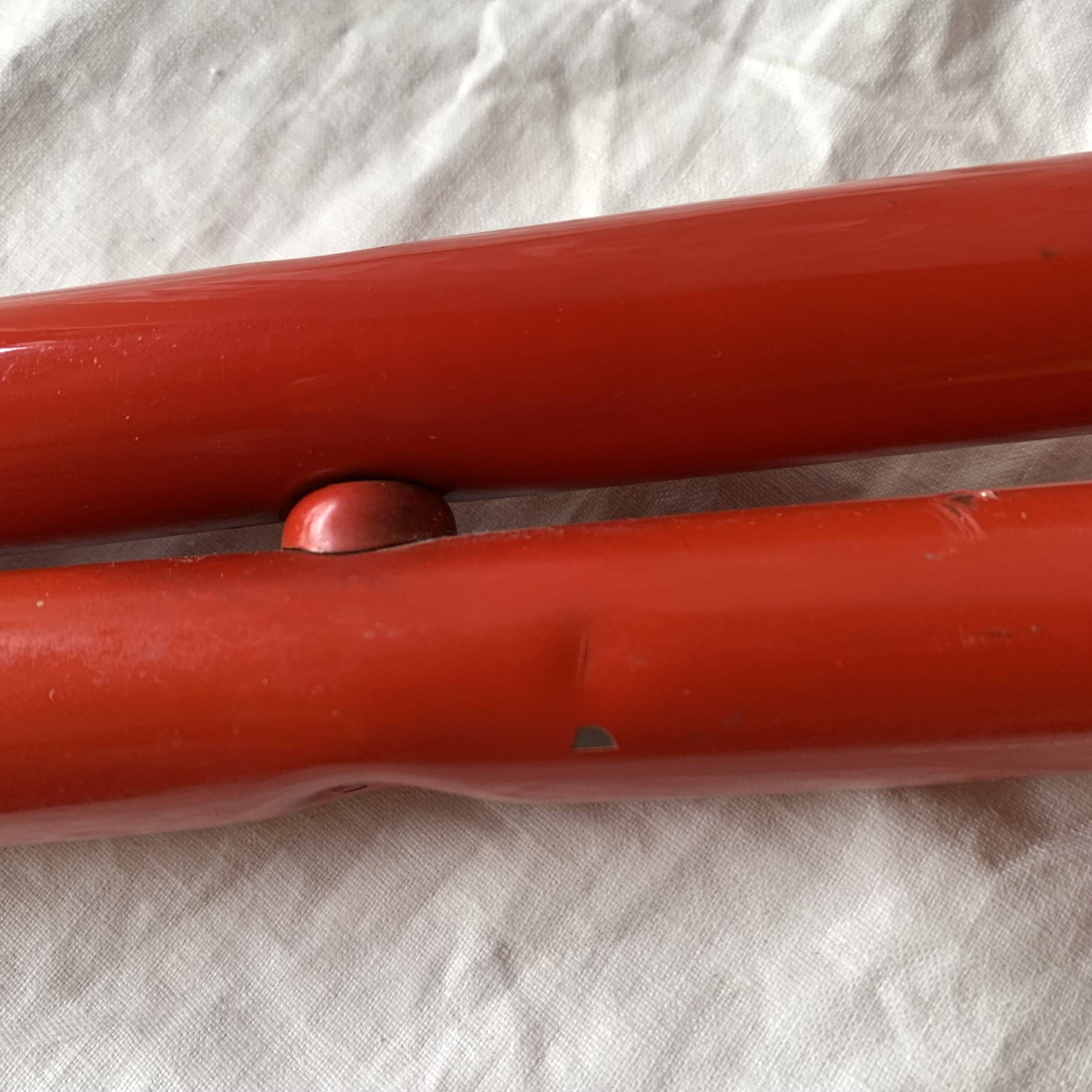 Vintage folding chair in red painted metal and wood