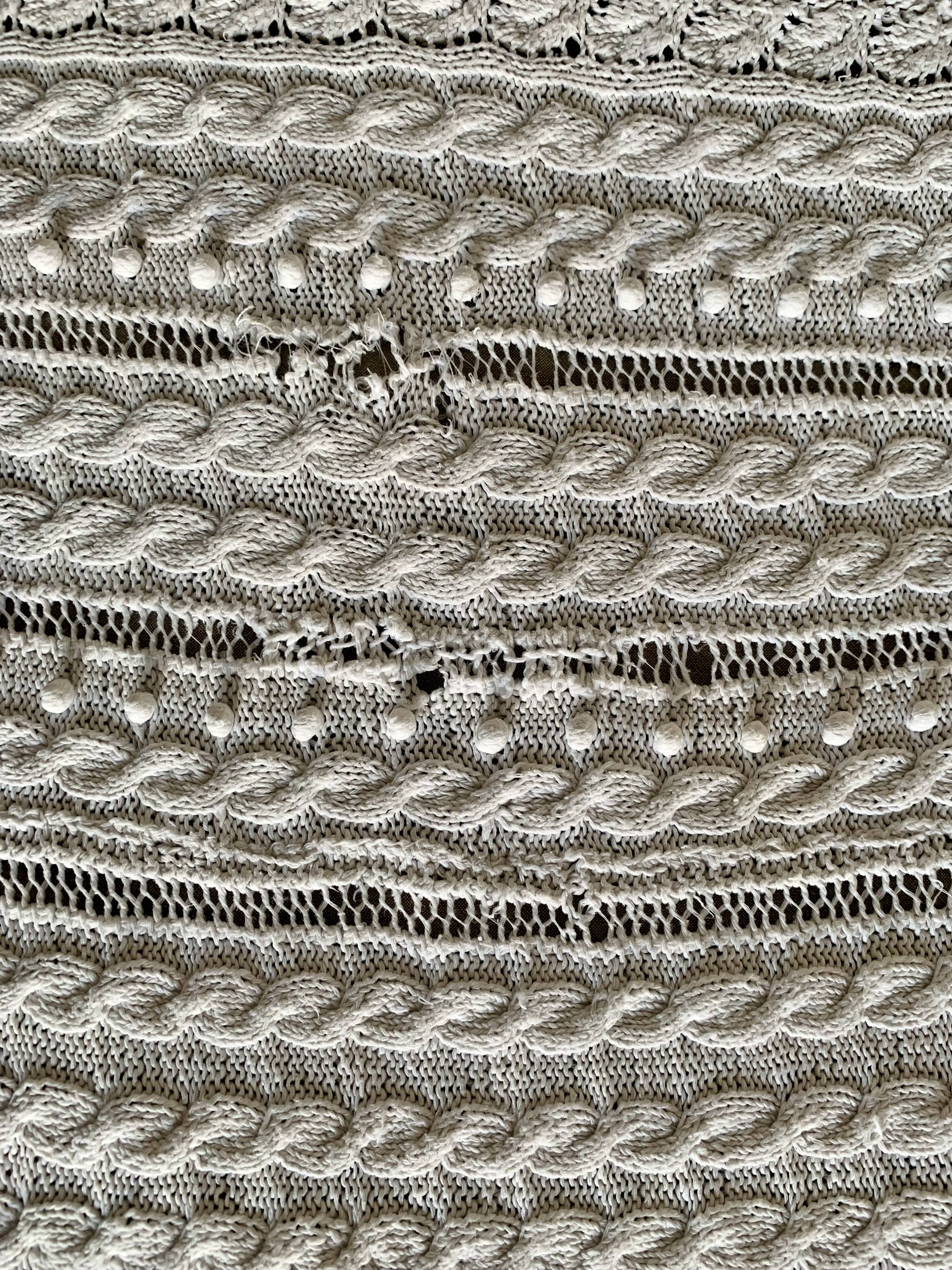 Old knitted cotton bed cover