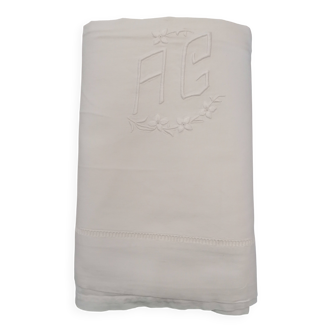 White flat sheet with AG monogram