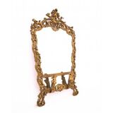 A large mirror in a gold frame, Italy, first half of the 20th century.