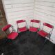 4 vintage folding chairs in red faux leather Plichaise, 1970s