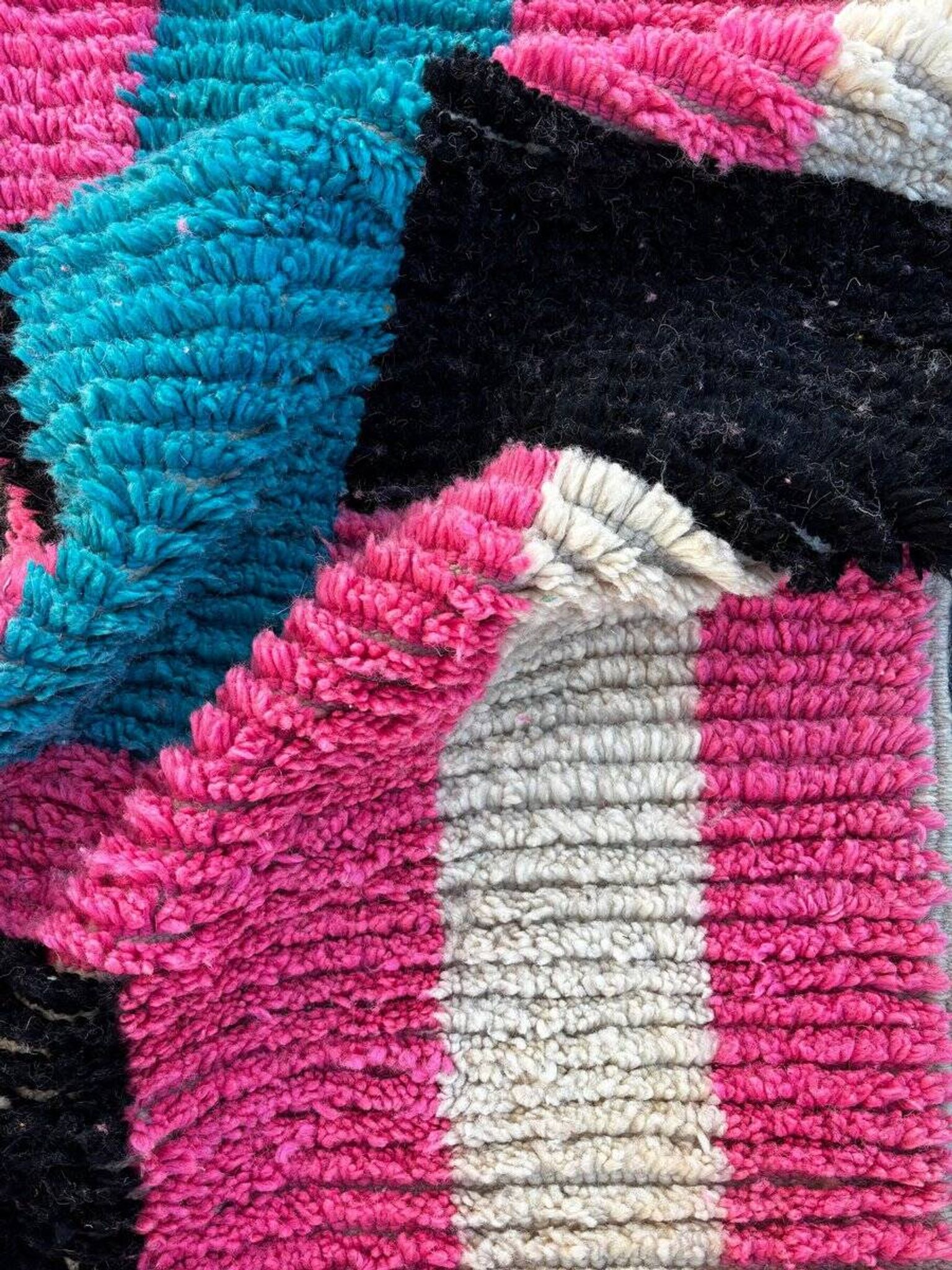 Moroccan Berber rug corridor in pink and blue wool.