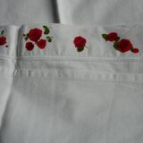 pair of monogrammed RB embroidered pillowcases in pink and red