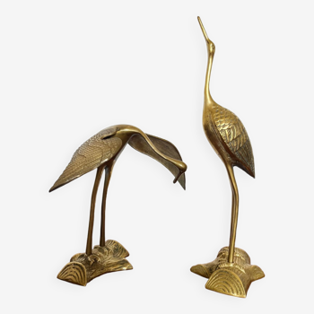 2 brass herons