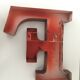 Red metal "F" sign letter