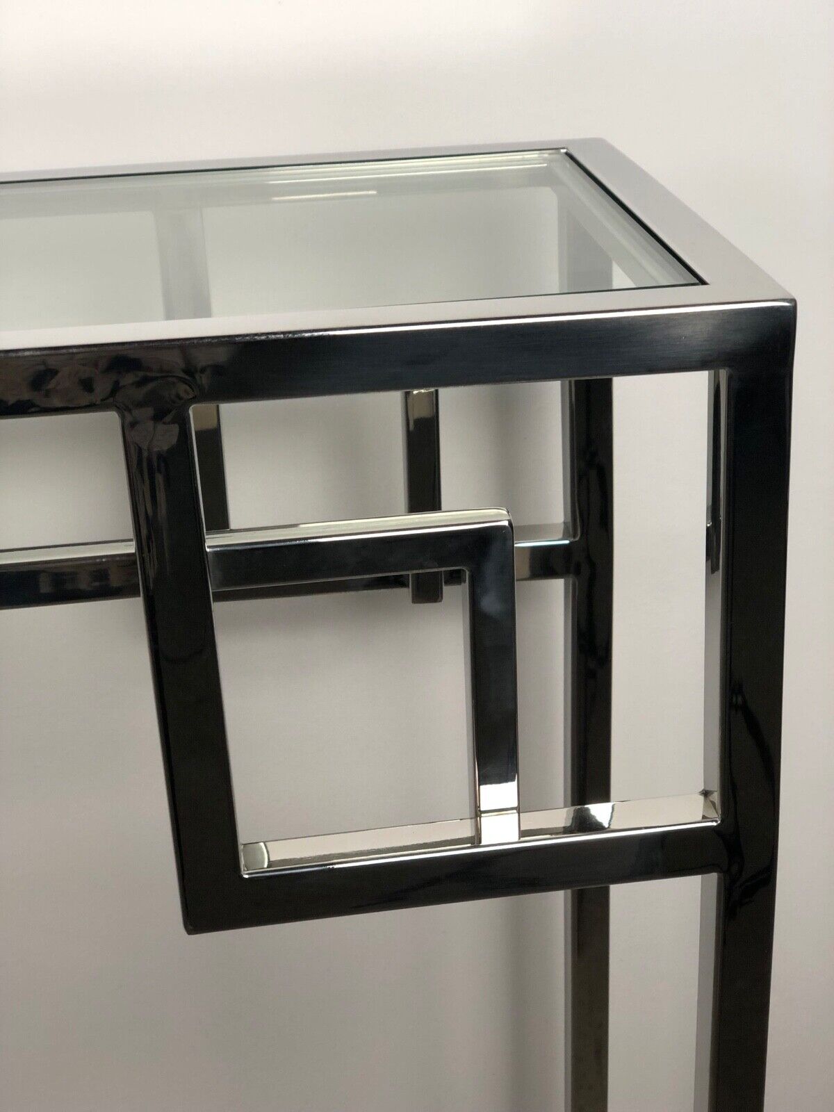 Art Deco style console in chromed metal with glass top