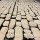 Large cream and black checked Berber rug, 280 × 200 cm.