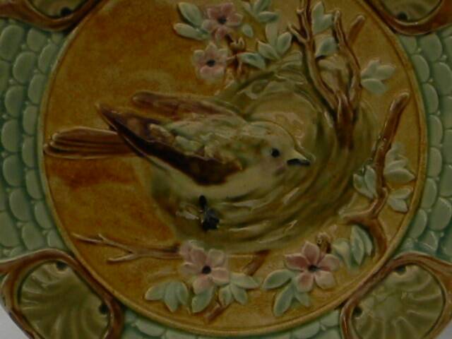 Slop bowl with bird decoration.