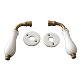 Set of two porcelain door handles with two rosettes