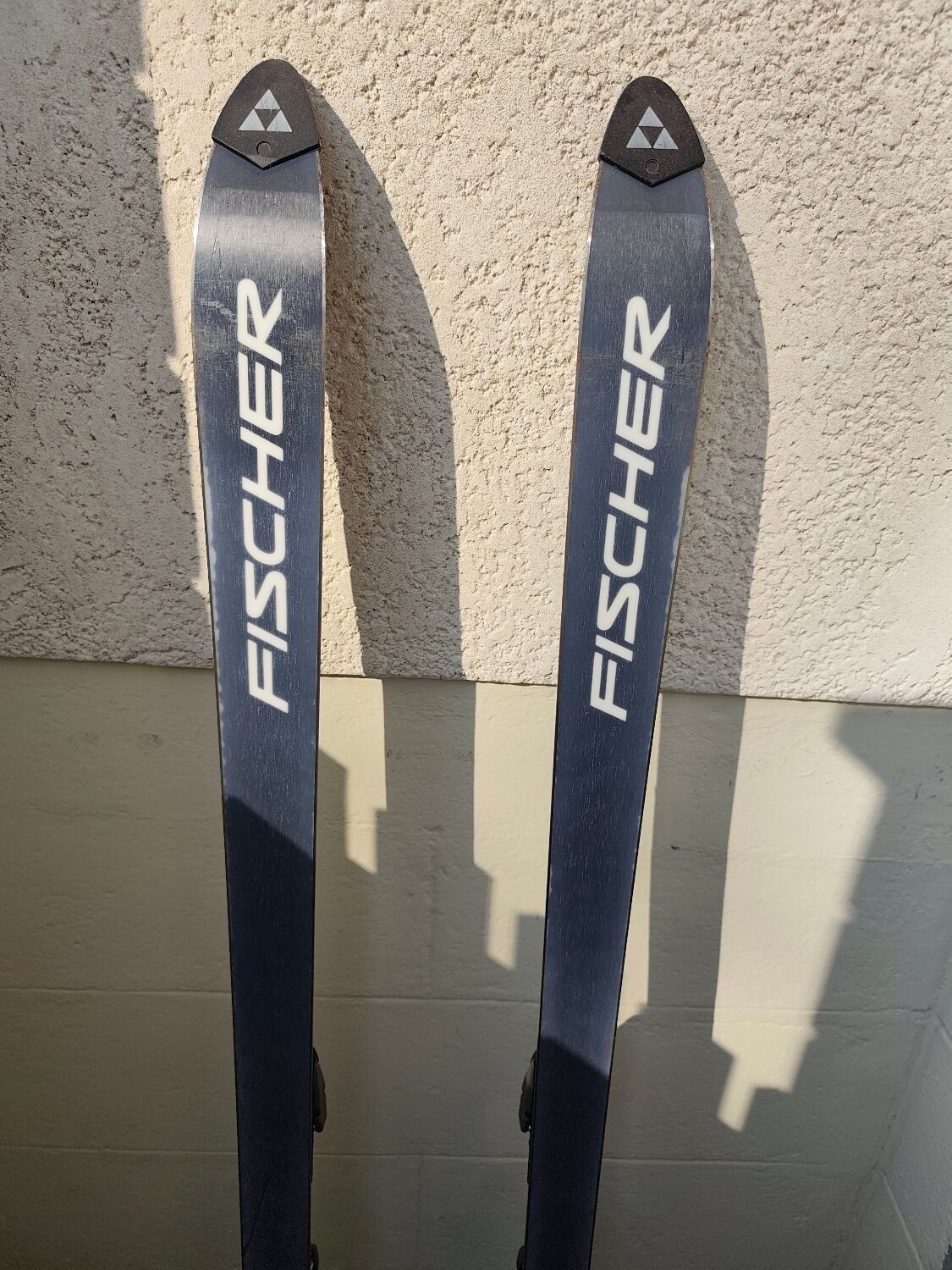 3 pairs of vintage skis: Rossignol Strato, ST 650 & Fischer.