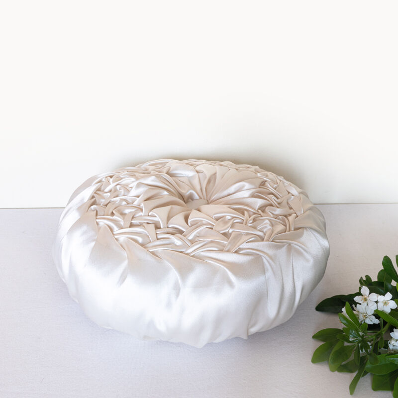 Old round cushion in white, beige pleated silk