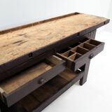 Brown painted workbench with shelf and drawers