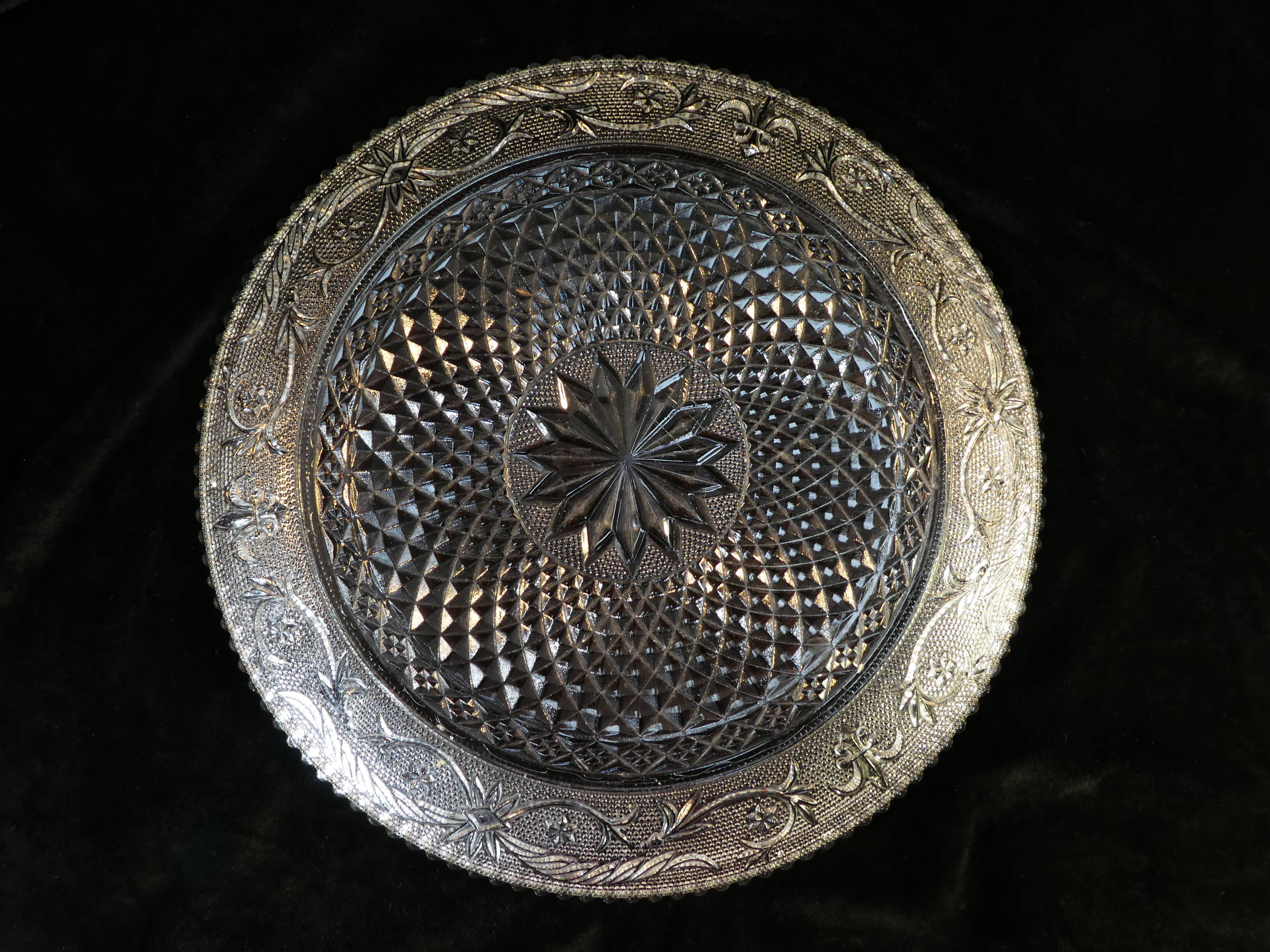 Old plate with pressed glass arabesque pie
