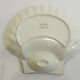 Shell-shaped porcelain pocket bowl from Queen’s Porcelain, with a gold rim.