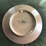 Small decorative chiseled ceramic plate