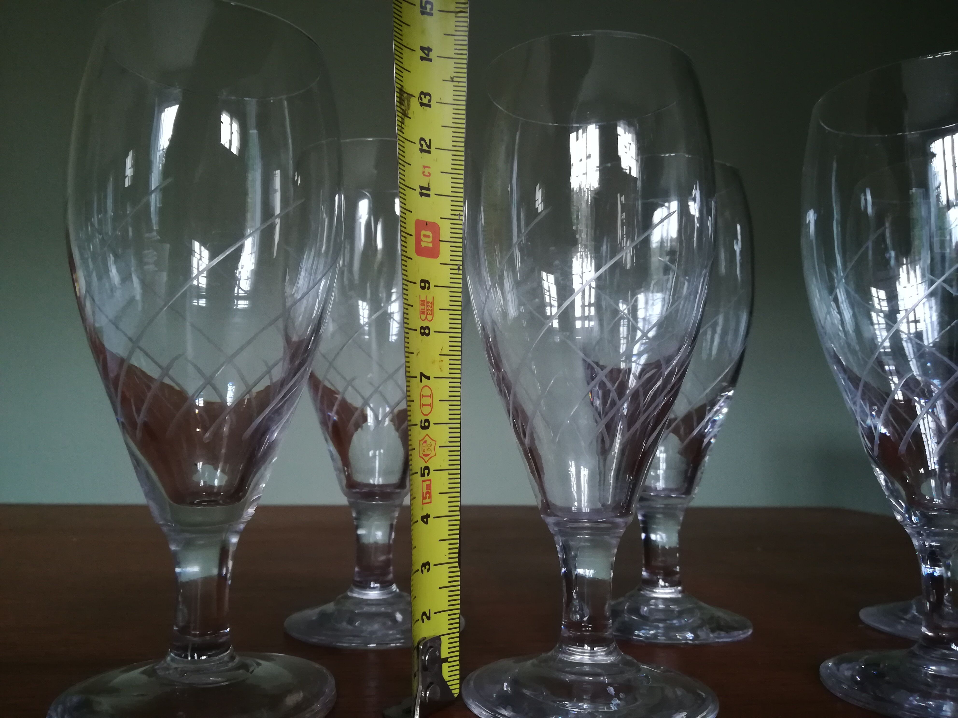 Eight champagne flutes in engraved glass