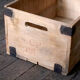 Wooden crate with metal fittings