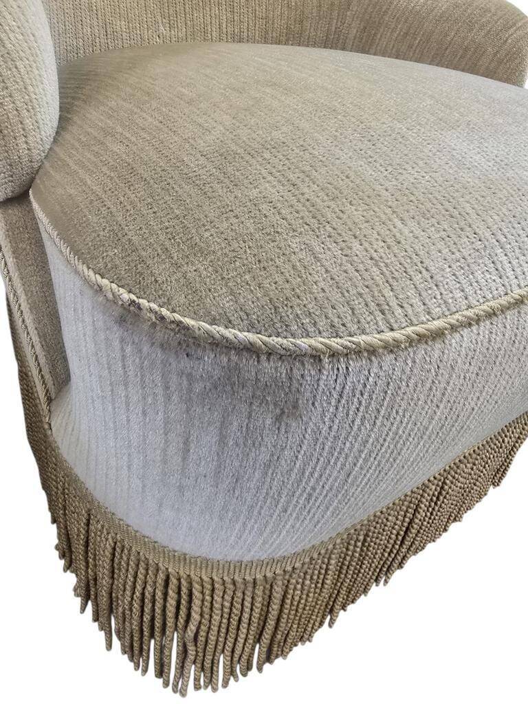 Set of 2 vintage 'gold' armchairs with fringes.