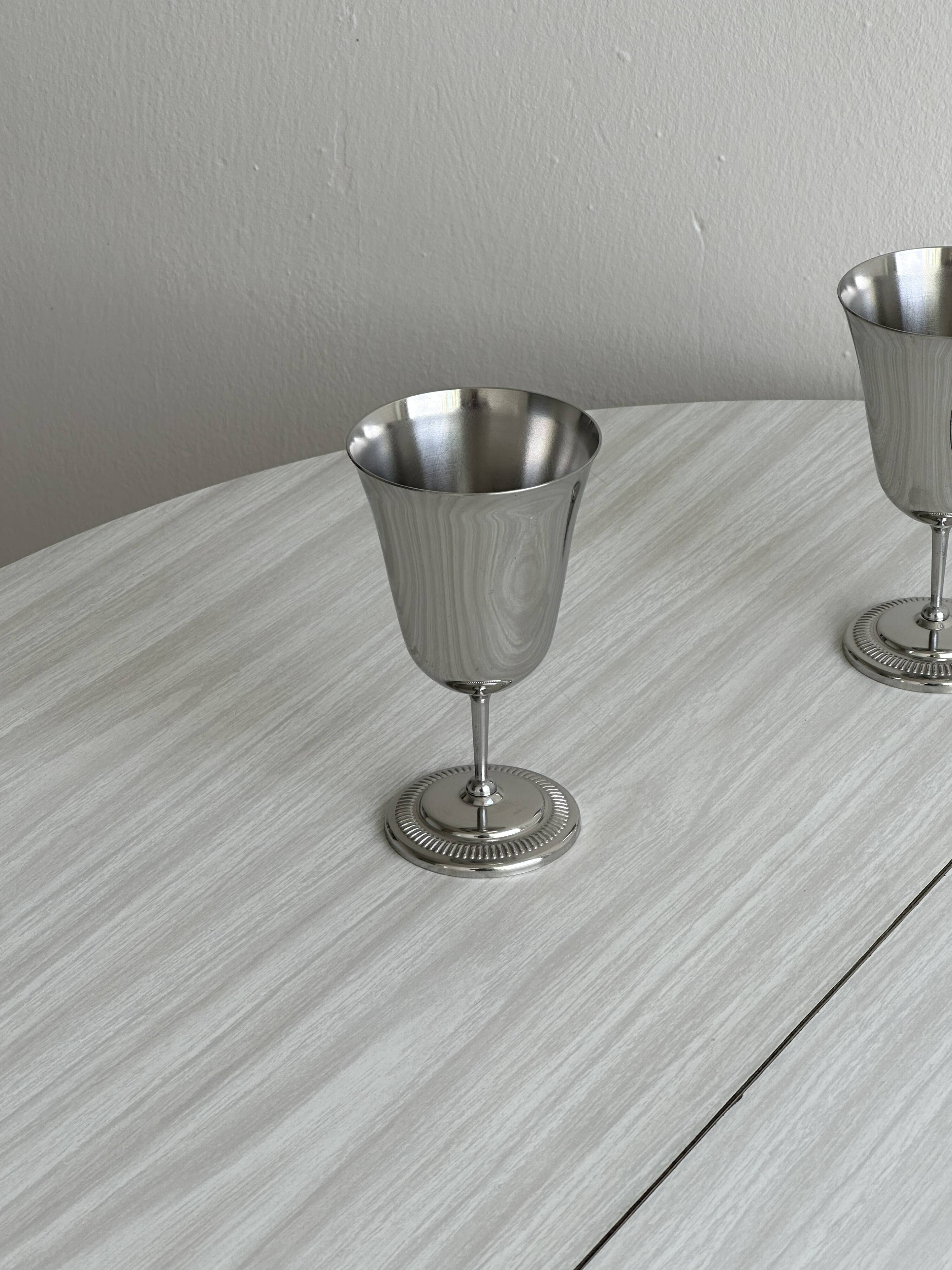Two metal cups