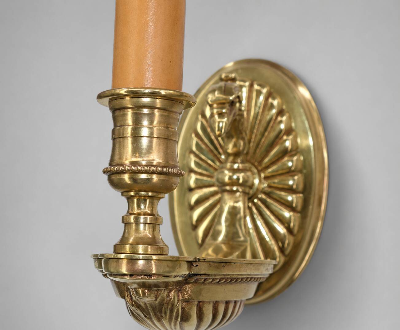 Pair of gilt bronze wall sconces in Directoire style by Lucien Gau.