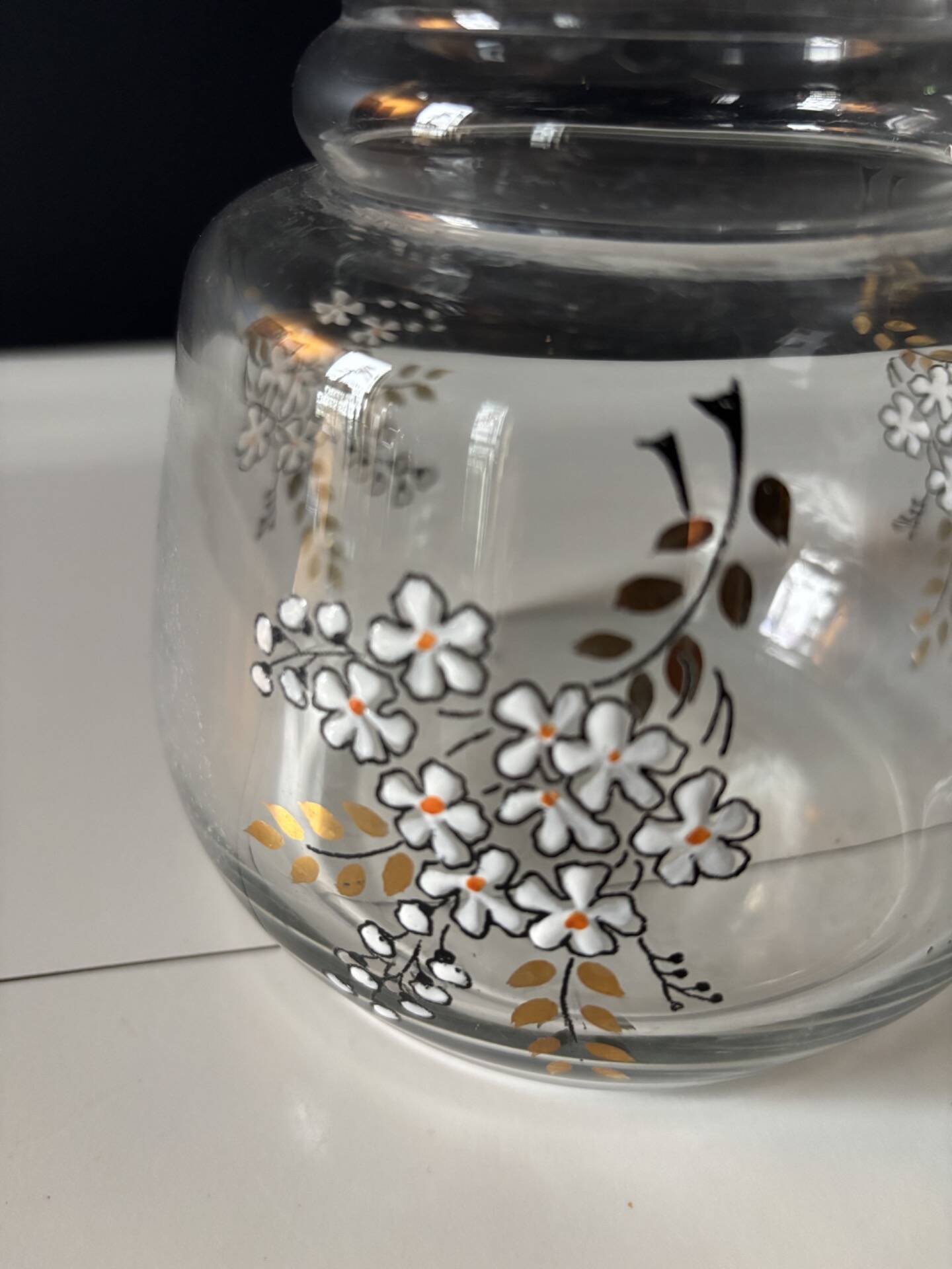 Vintage glass carafe with floral decoration