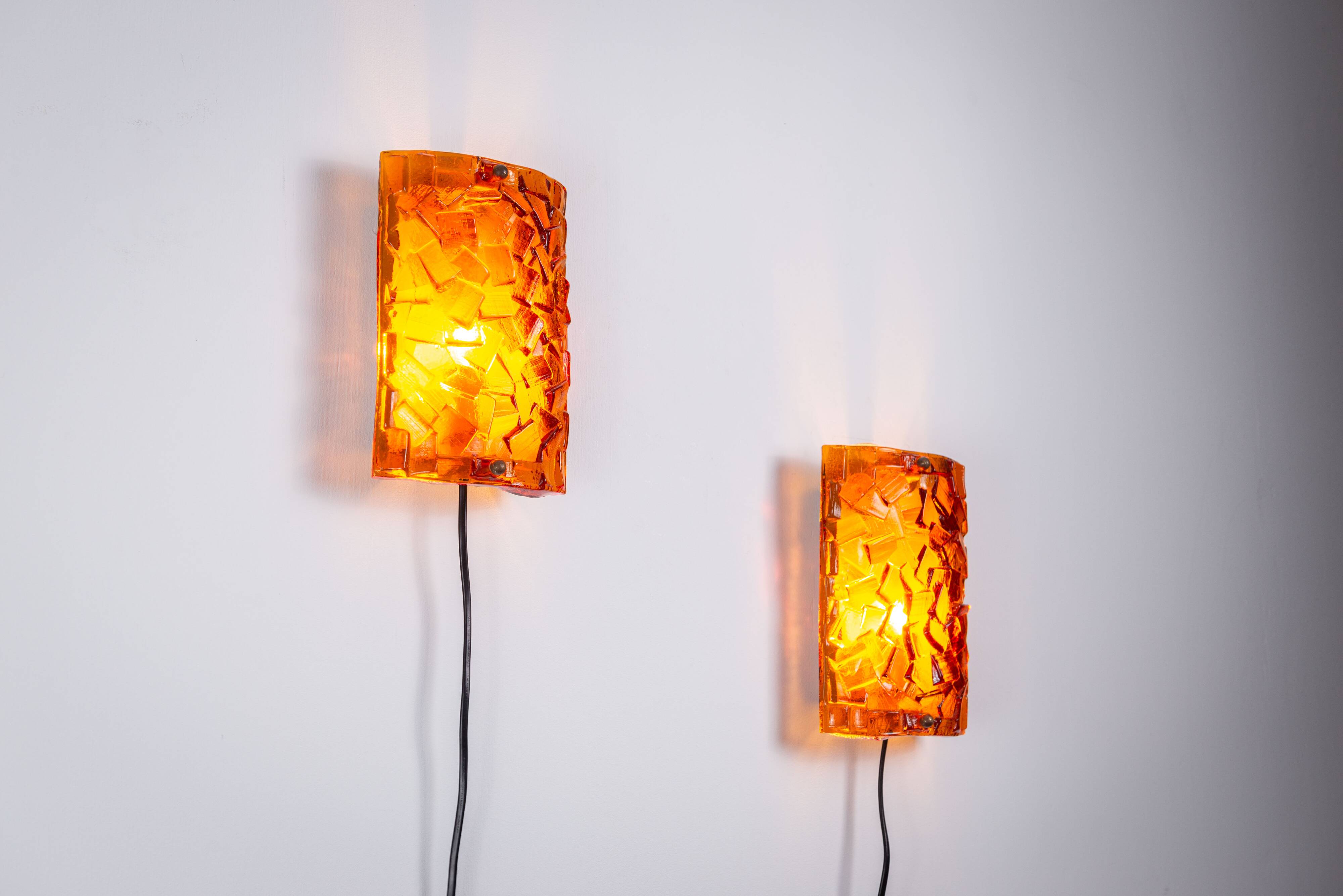 Vitrika Nybro amber coloured wall lamps