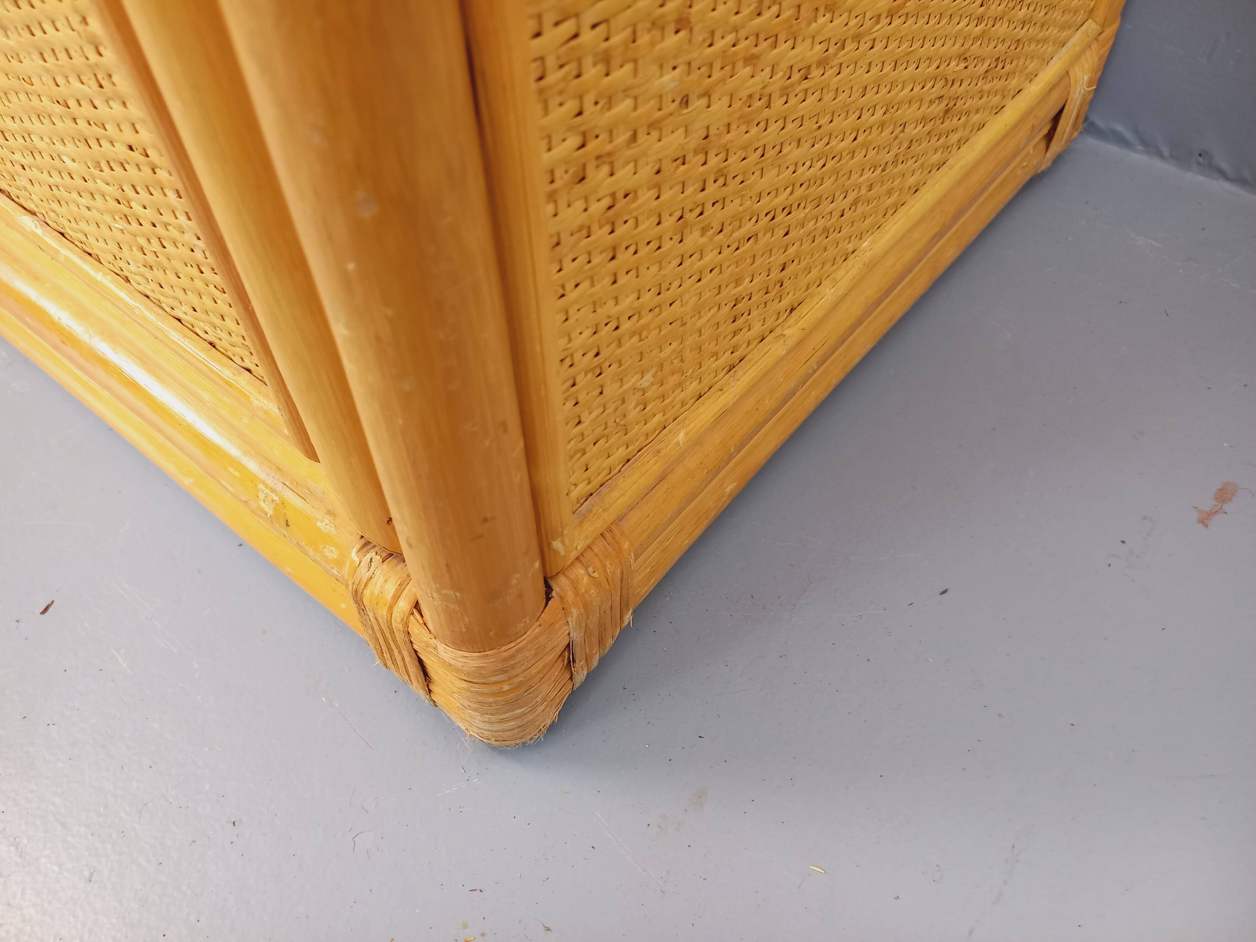 Vintage storage unit in rattan and woven rattan from the 1970s.